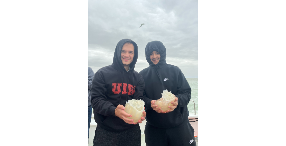 Two students holding jellyfish