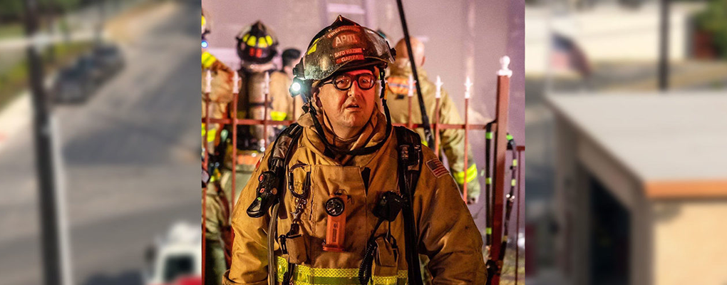 Greg Garza wears his firefighter uniform
