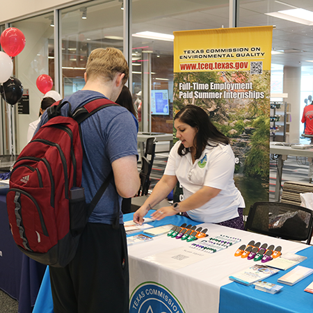 Student talking to a job representative