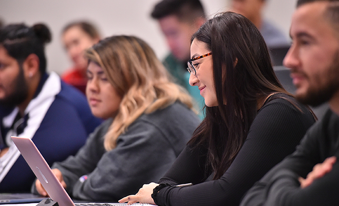 Graduate students sitting in a classroom