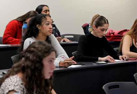 Front of a UIW classroom view of a UIW professor teaching a full HEBSBA MSA class