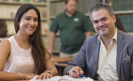 Two professionals sitting at a table.