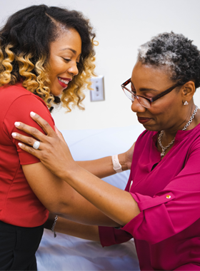 Physical Therapy student helping a patient