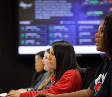 Business students in a trading room