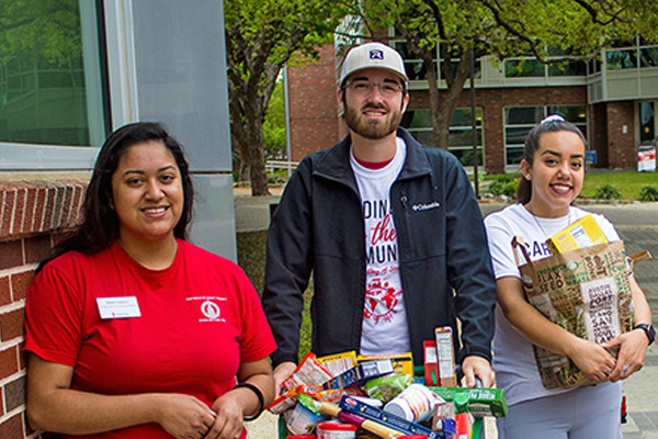 students holding food