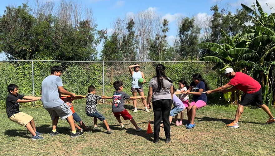 UIW students playing with kids