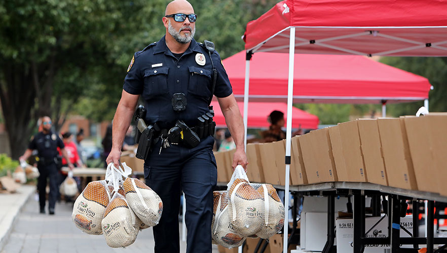 UIWPD officer carrying turkeys