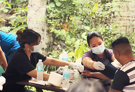 medical students helping a community member