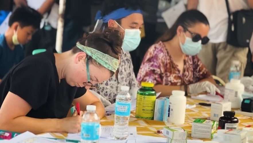 Students looking at medication