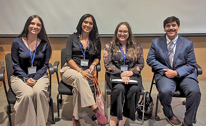 Student presenters smiling