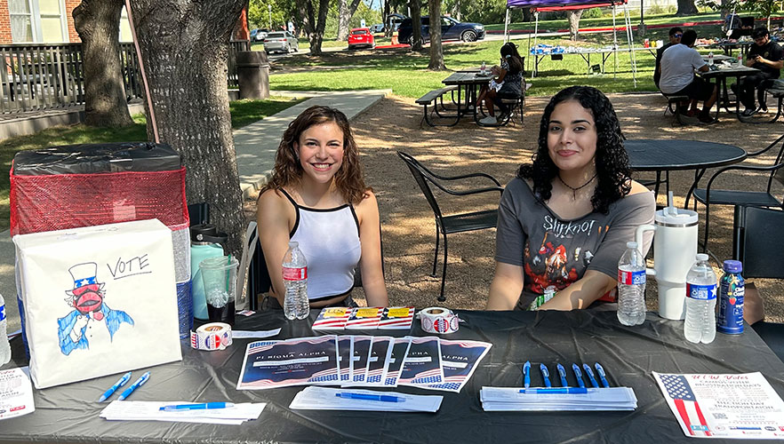 Students working an event table