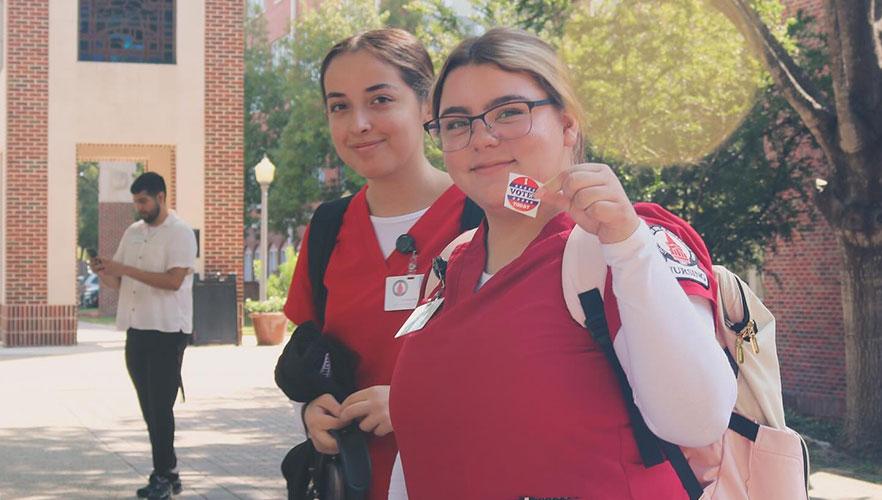 Students with voting sticker