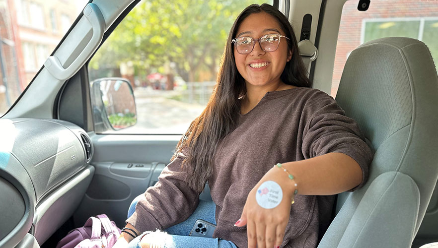 Student with voting sticker