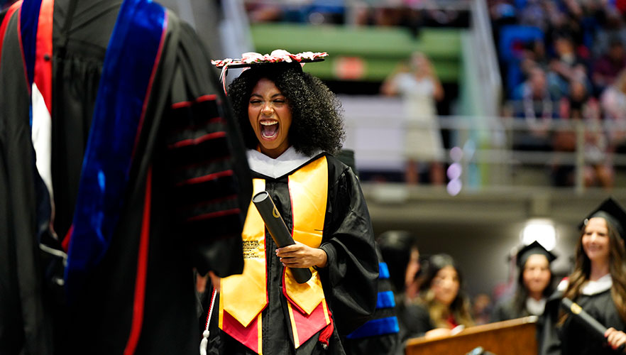 Graduate at commencement