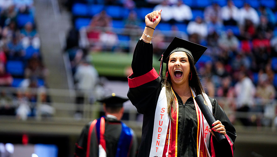 Graduate at commencement