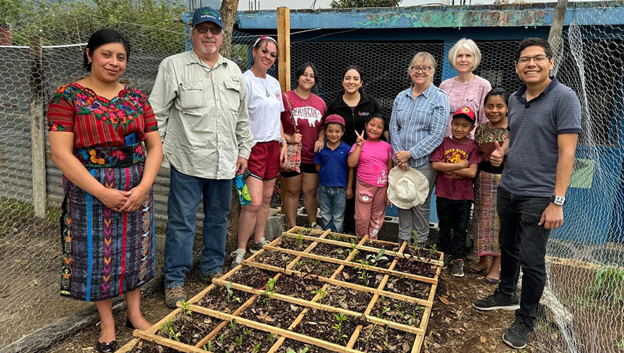 UIW community members helping to plant a garden