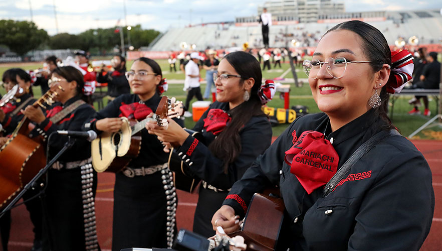 Mariachi Cardenal playing on football field