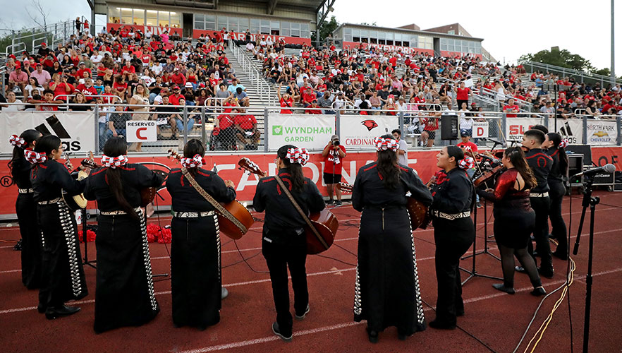 Mariachi Cardenal playing on football field