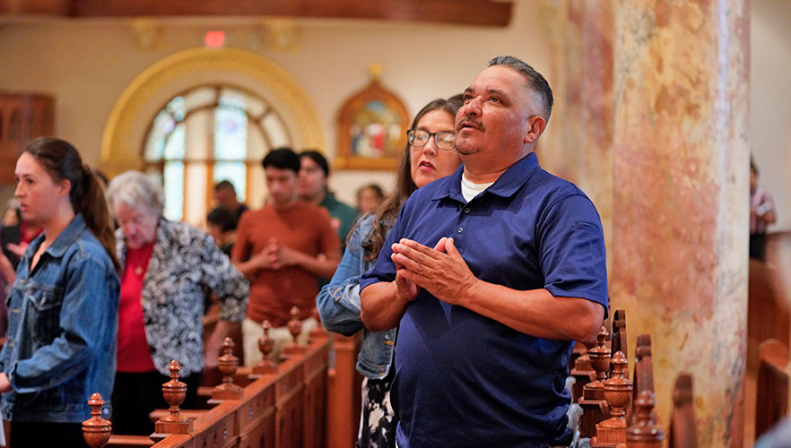 Attendees praying