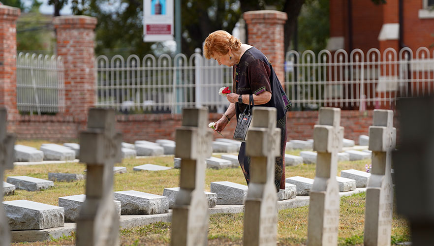 CCVI Sister playing carnation on grave