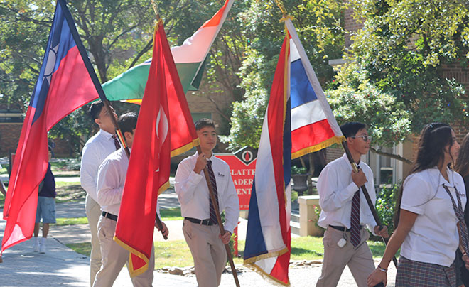 Students walking with flags