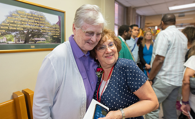 Sr. Walter Maher and employee