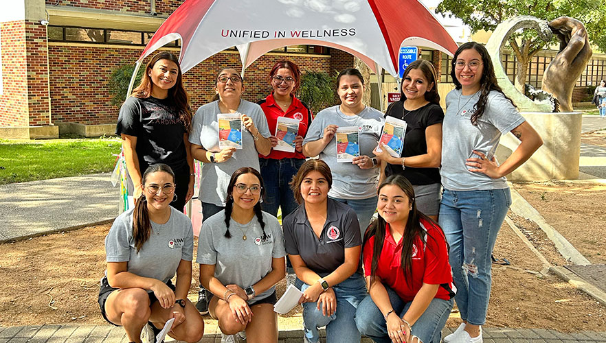 Garza with Unified in Wellness members