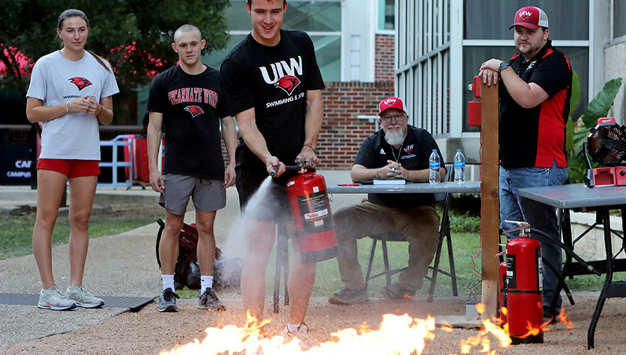 UIW students participating in fire demonstration