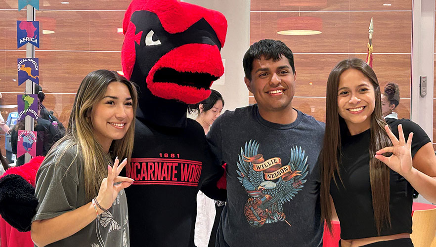 Red the Cardinal with students