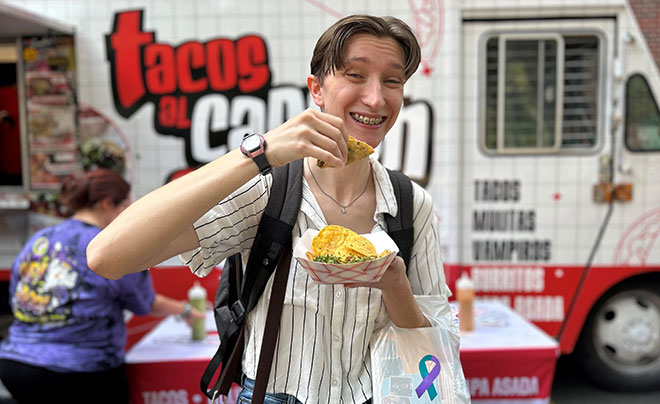 Student with tacos