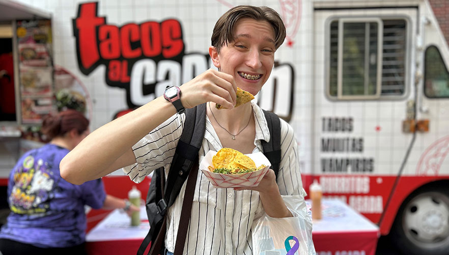 Student with tacos