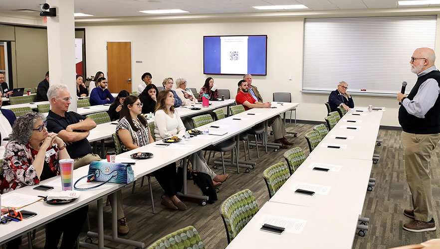 Guests listening to lecture