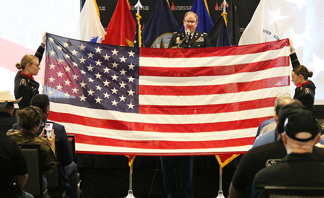 Cadets holding American flag