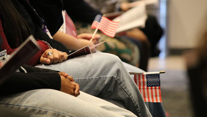 Guests holding American flags