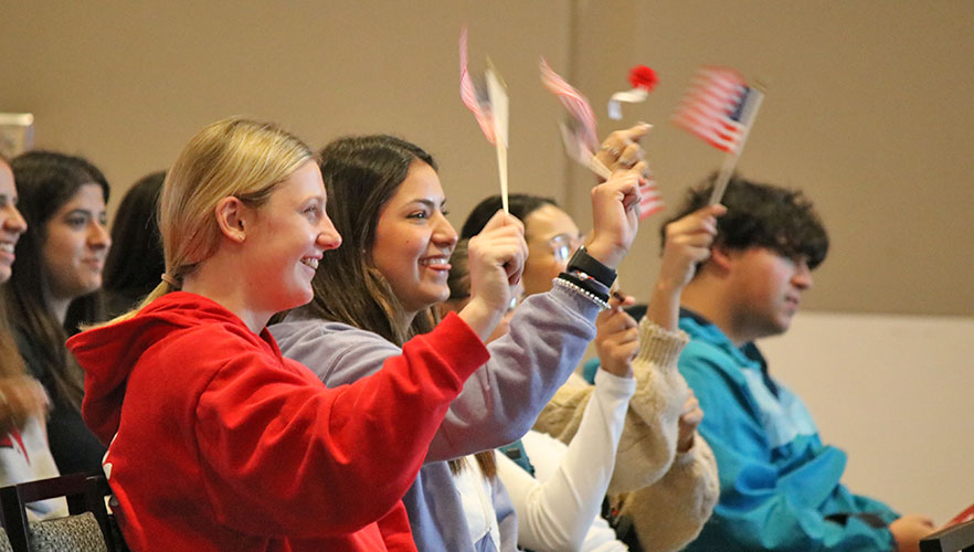 Guests waving American flags