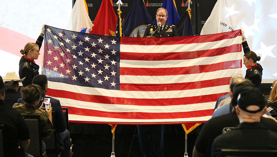 Cadets holding American flag