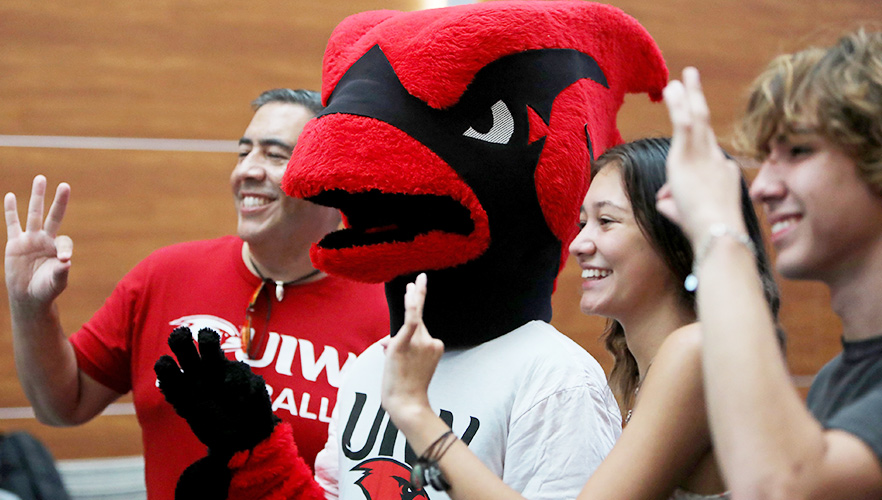 cardinal with students