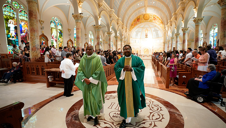 two chaplains walking down church aisle