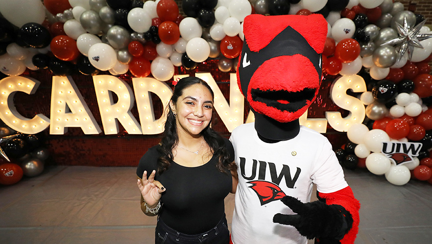 red cardinal with a student