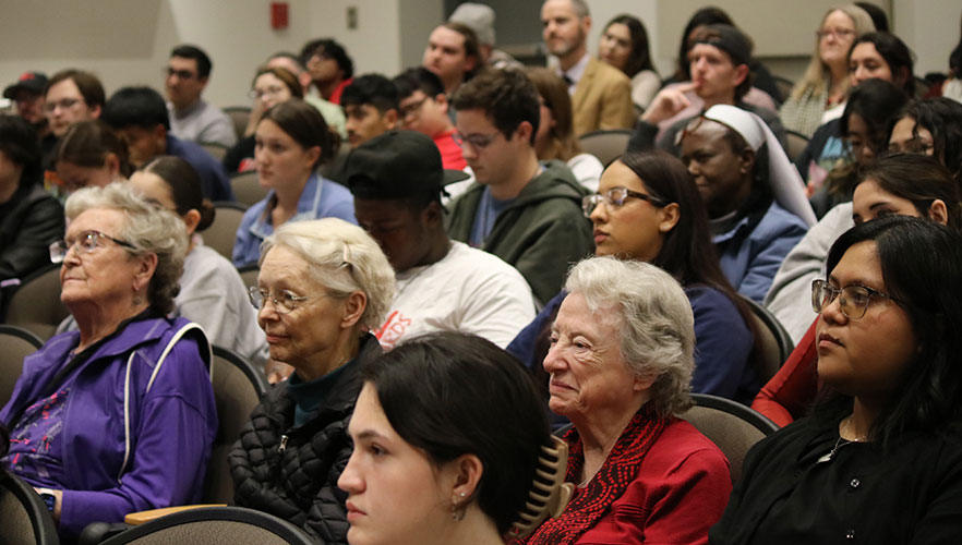 Guests listening to Dr. Karen Eifler's lecture