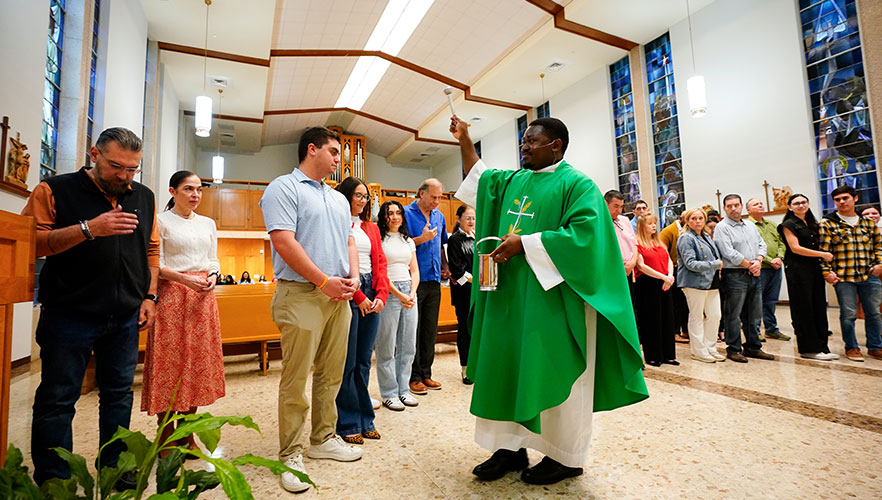 Couples receiving blessing