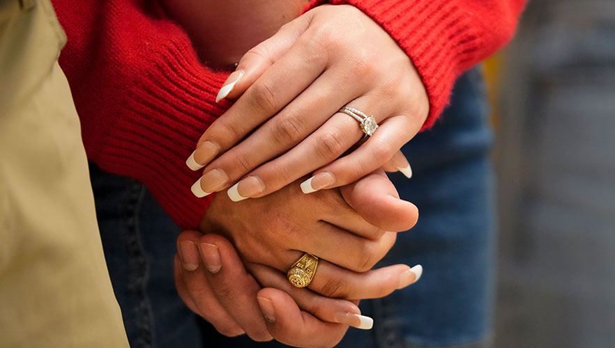 Couple holding hands