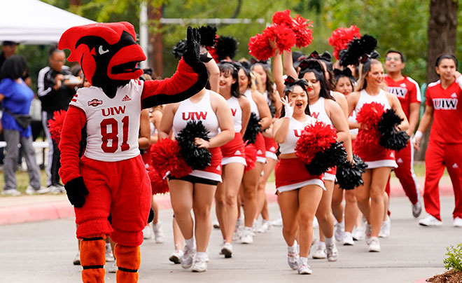 Red the Cardinal with UIW Cheer team