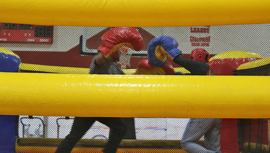 Students in inflatable boxing ring