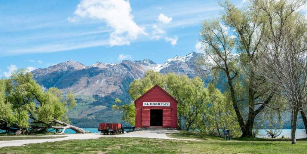 lakeside view of mountains with barn labeled Glenorchy